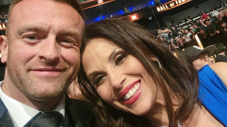 "WWE SmackDown" General Manager Nick Aldis poses alongside wife Mickie James before the WWE Hall of Fame ceremony in 2024.