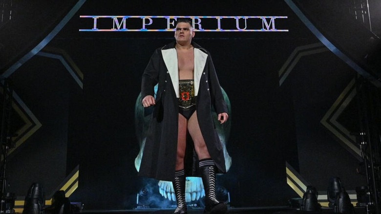 Imperium's GUNTHER talks down the ramp, wearing the NXT UK Championship before a match.
