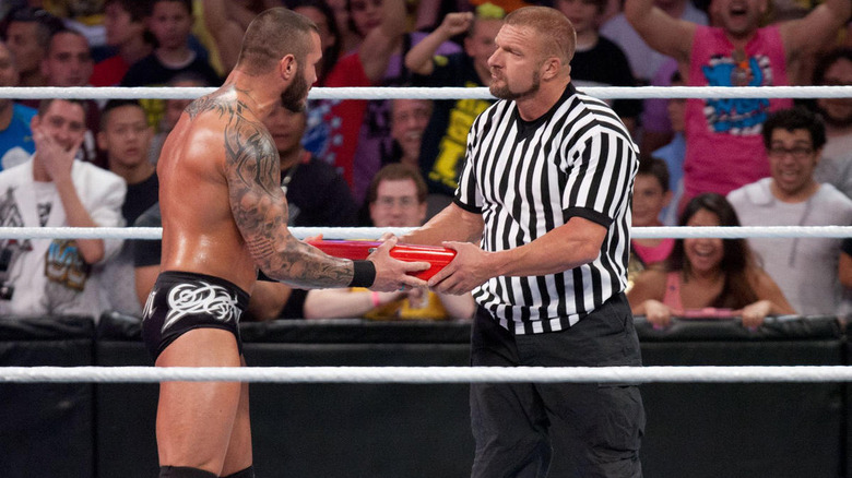 Randy Orton cashing in money in the bank