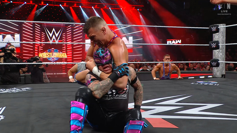 Julius wearing down Rey with a submission hold
