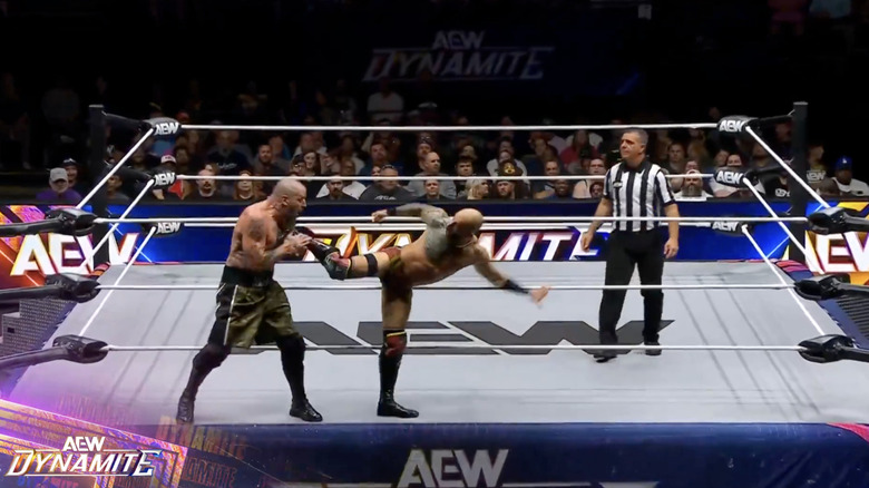 Ricochet about to land a kick on Mark's midsection
