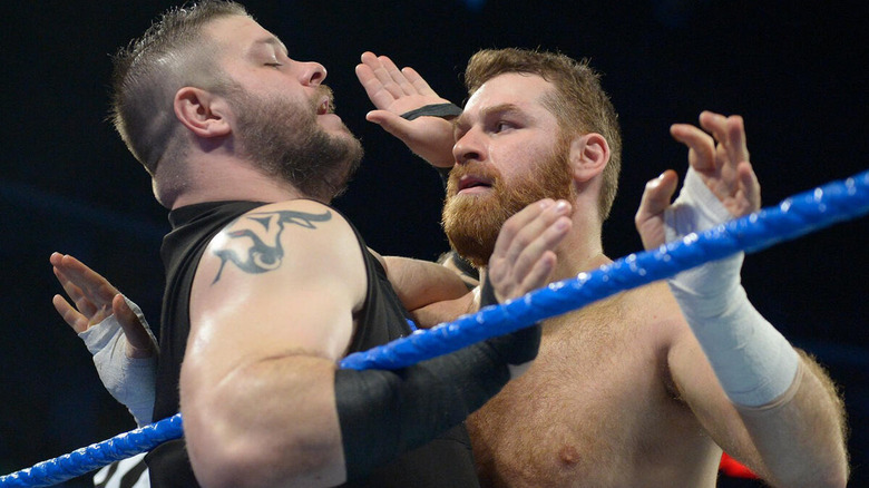 Kevin Owen and Sami Zayn tied up in the ropes