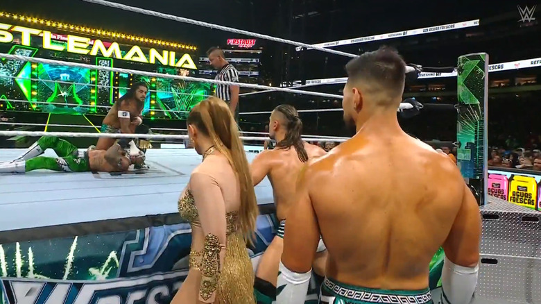 Escobar beating down Rey as Legado watches on