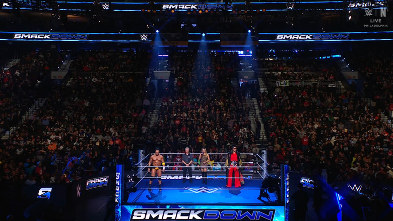 Knight and Nakamura standing in the ring