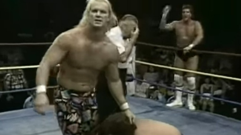 Steve Austin holding Chris von Erich by the hair