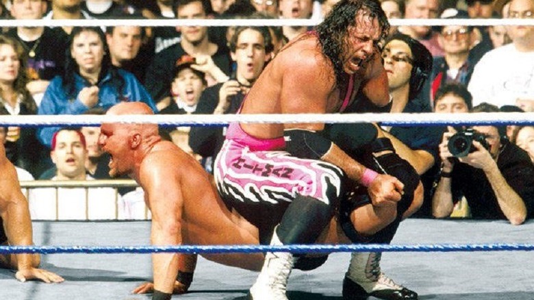 Bret Hart puts Steve Austin in the Sharpshooter