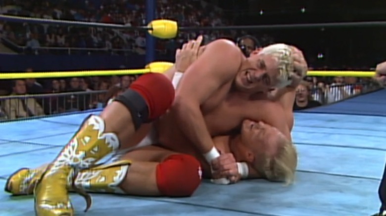 Dustin Rhodes with Steve Austin in a headlock