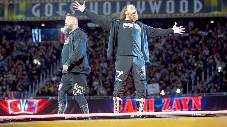 Kevin Owens and Sami Zayn pose for the crowd at WWE WrestleMania 39.