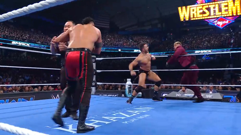 Tama, Knight, and Sikoa in the ring