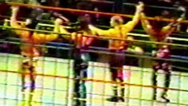 Triple H, Shawn Michaels, Kevin Nash, and Scott Hall take a bow during what has become known as the infamous "Curtain Call" at Madison Square Garden.