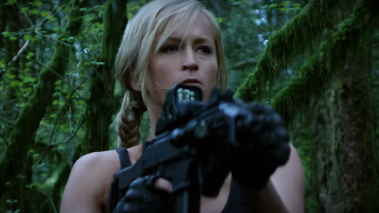 Summer Rae holds gun