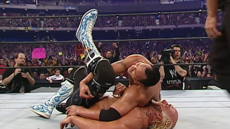 The Rock pinning Hulk Hogan