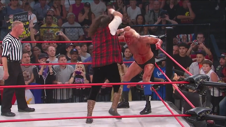 Foley steps on Ric Flair