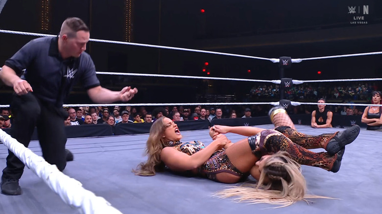 Henley with a submission locked in on Hail's arm