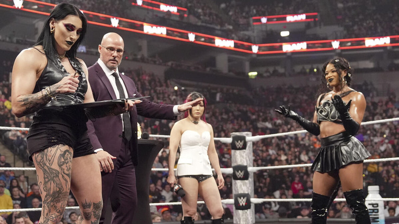 Rhea Ripley signs a contract as Adam Pearce attempts to keep the peace between IYO SKY and Bianca Belair.