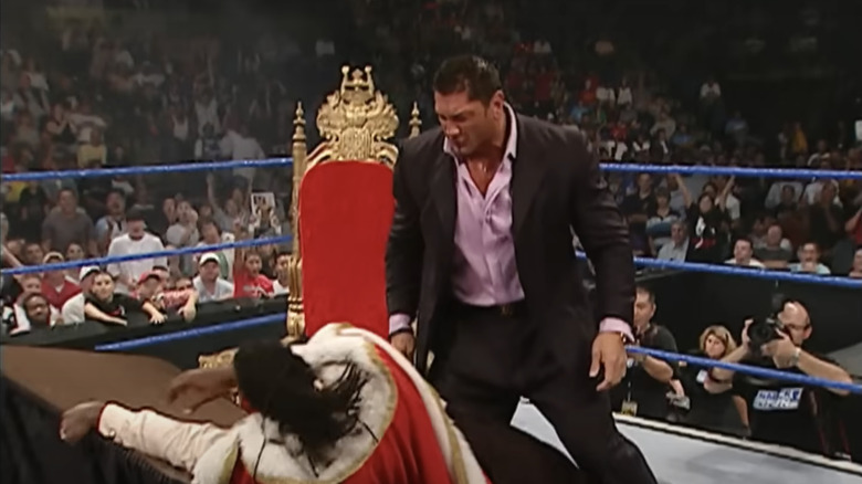 Batista's first attempt at putting King Booker through the table doesn't go so well.