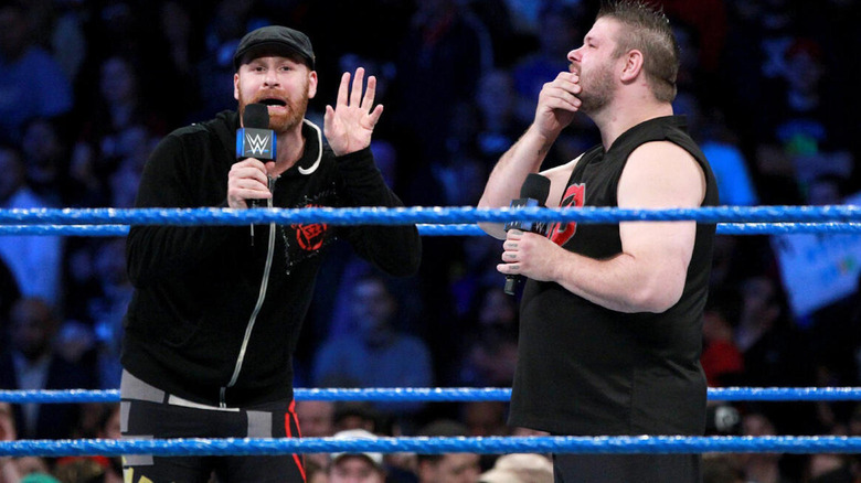 Sami Zayn and Kevin Owen make mocking poses in the ring on "WWE SmackDown."