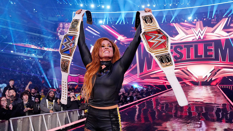Becky Lynch holding the Raw and SmackDown Women's Championships