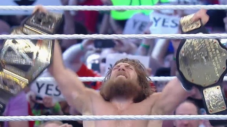 Daniel Bryan celebrating winning the championship